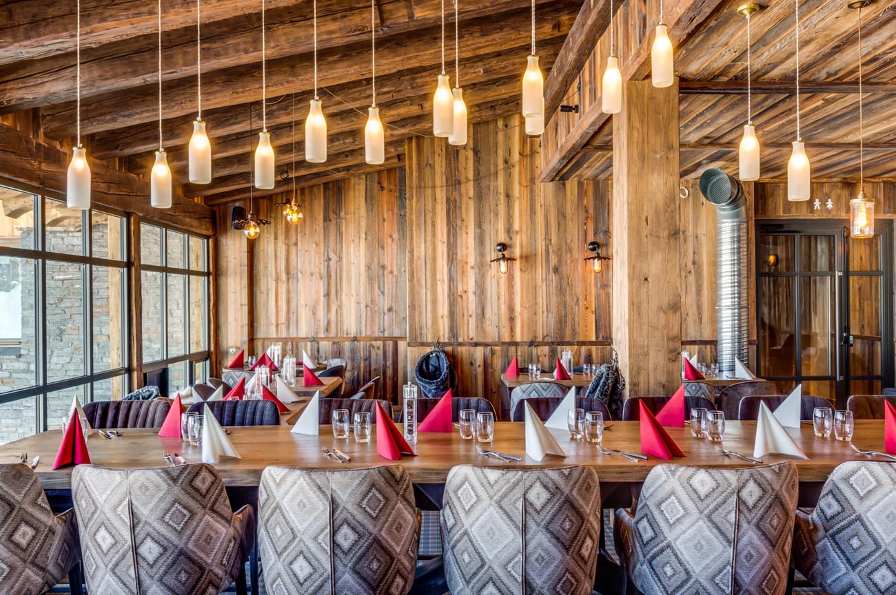 Mullan Lighting pendant fixtures installed over a restaurant table