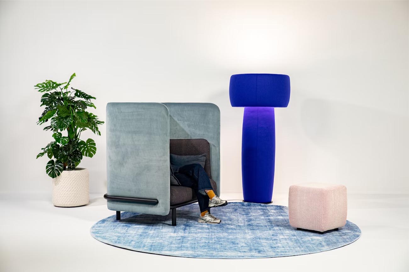 Blue Buzzispace Buzzishroom upholstered lamp placed next to a chair