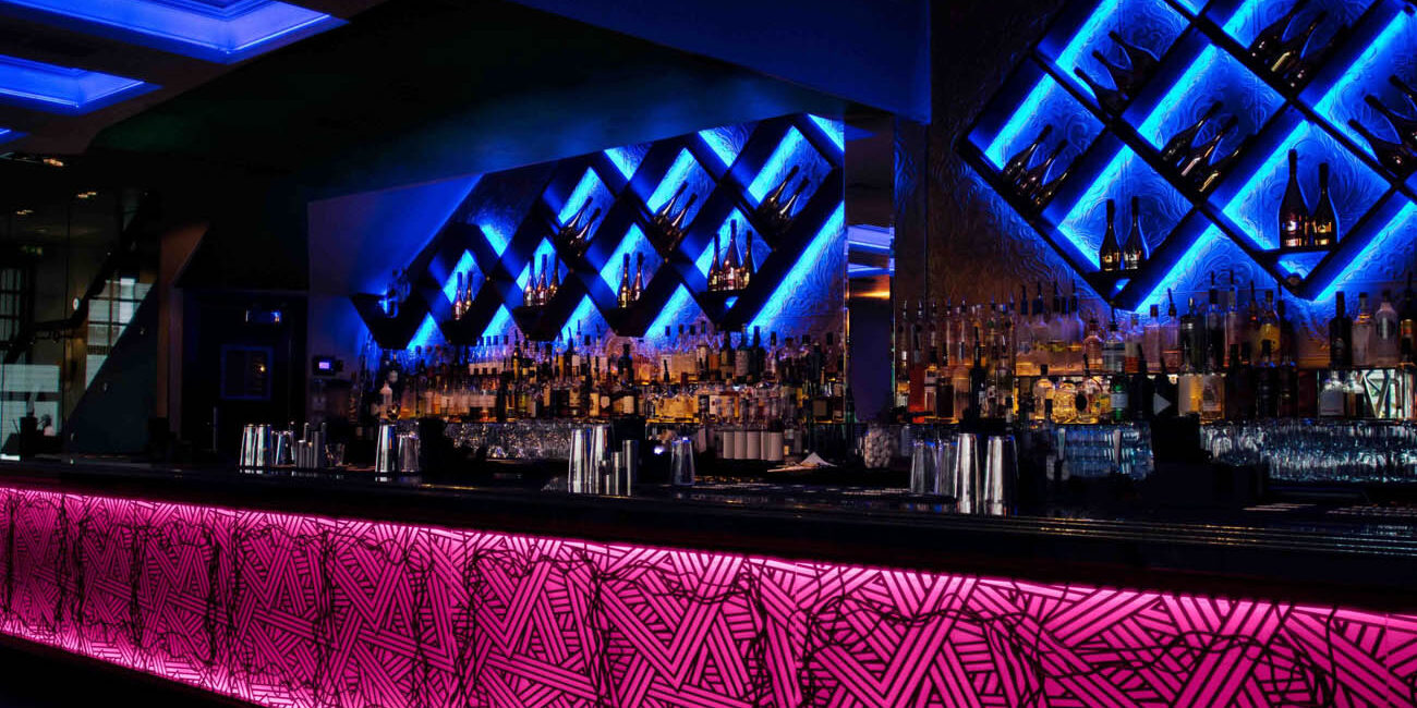 WAC Lighting Invisiled cove lighting installed behind a bar