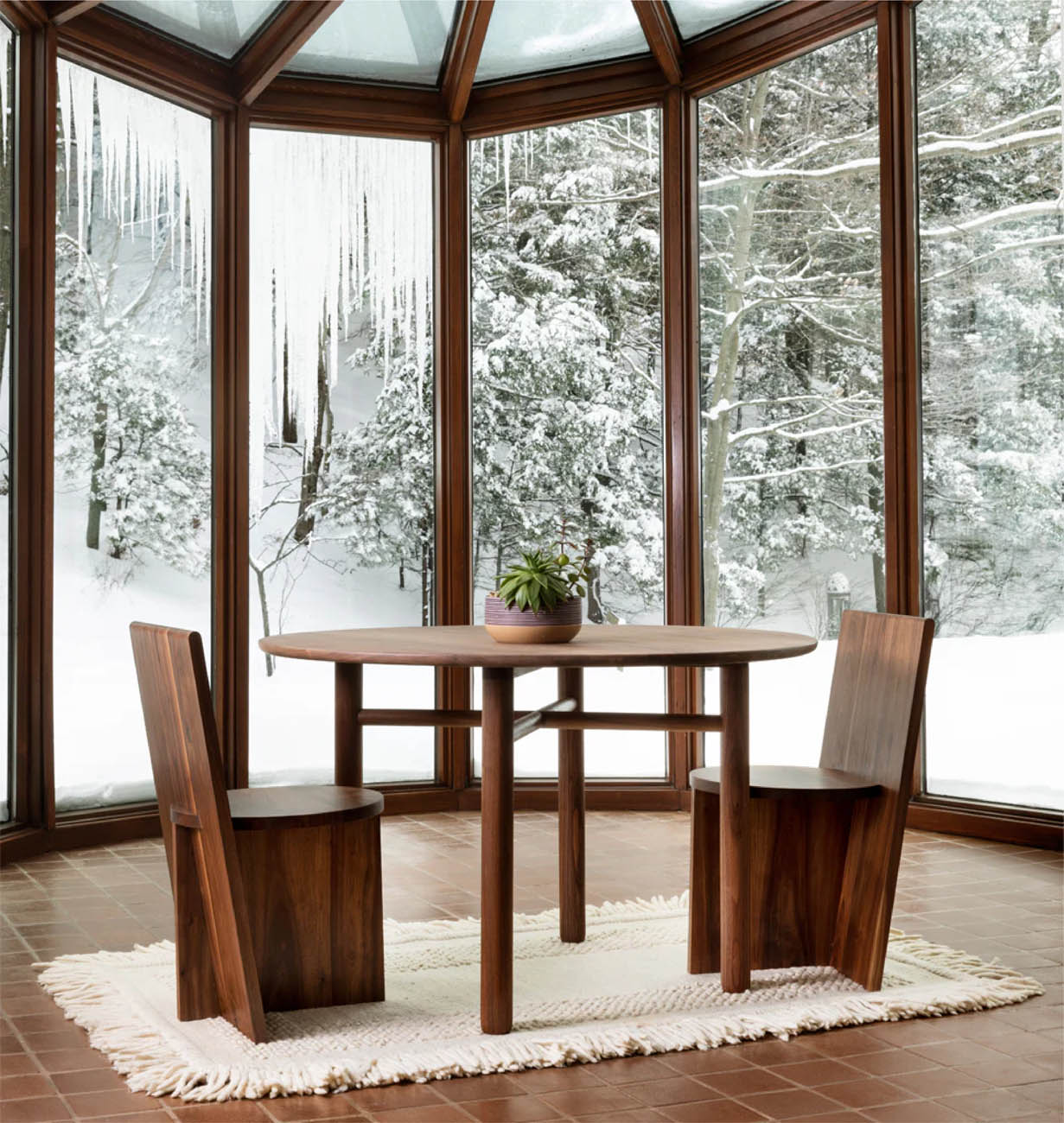 A modern wooden chair and table set by Roll & Hill