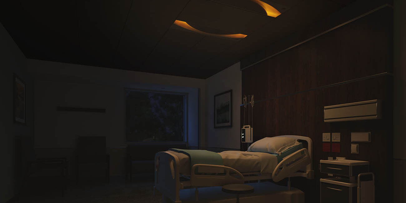 Focal Point Saros Duo™ light fixture set to nightlight mode in a hospital room