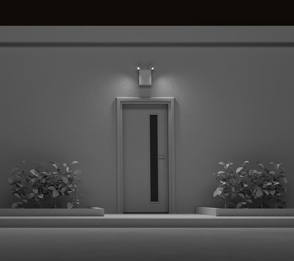 Black and white rendering of an Isolite OLLO emergency lighting installed over a door