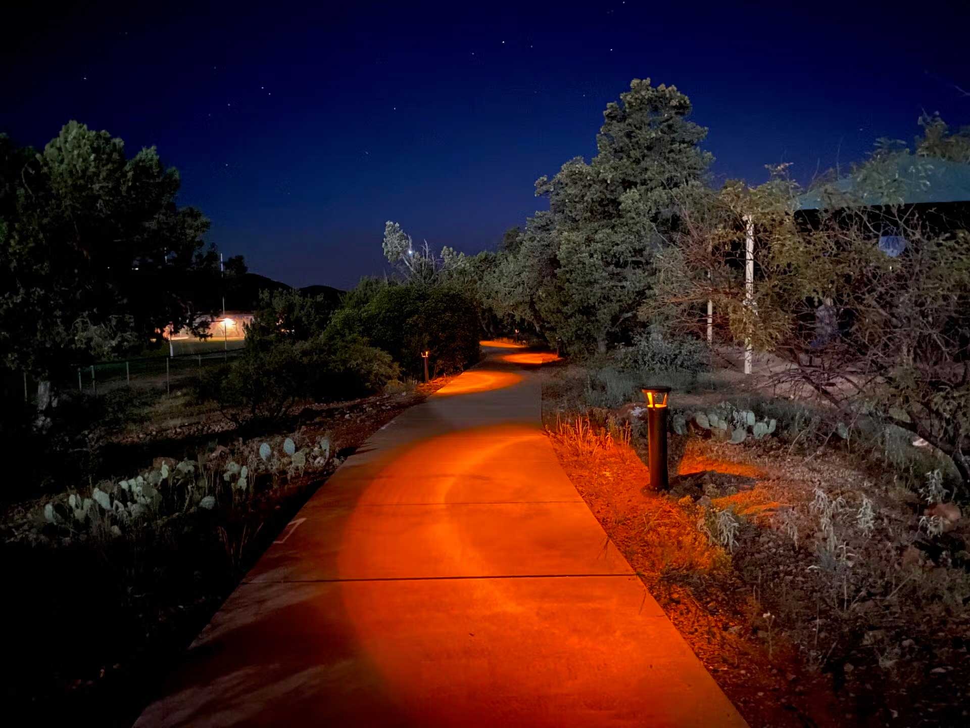PLB Bollard by FLT casting red light on a pathway
