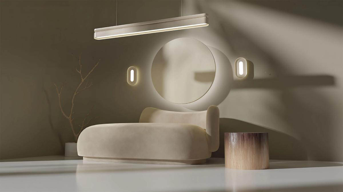 A white Nulite studio linear suspended luminaire and two Nulite Studio wall sconces installed over a modern couch