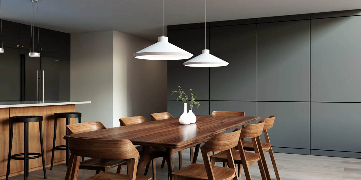 White Sonneman Koma pendant lights installed over a dining room table